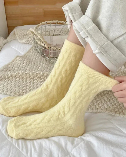 Long fluffy socks with a braided pattern