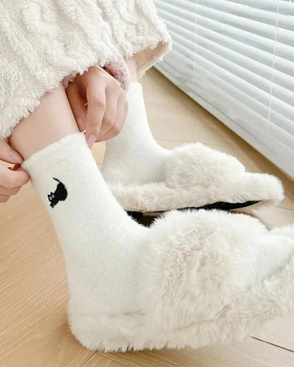 Warm fluffy socks with a kitten