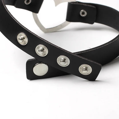 Adjustable leather choker with a heart.