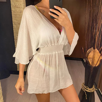Breezy beach dress with a deep wrap neckline.