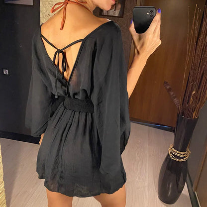 Breezy beach dress with a deep wrap neckline.