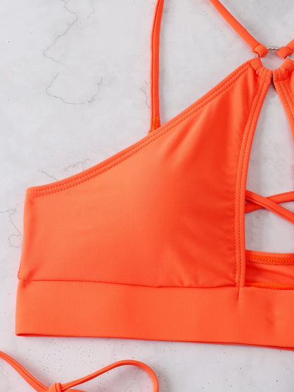 Two-piece swimsuit with a cut-out at the bust.