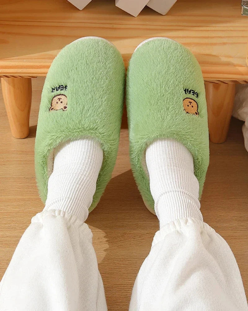 Warm fluffy slippers with a bear