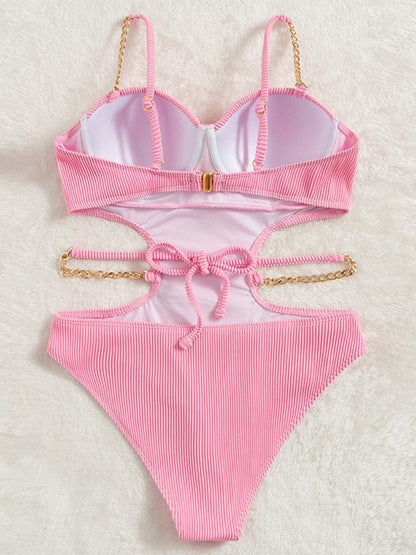 One-piece swimsuit with cut-outs at the waist