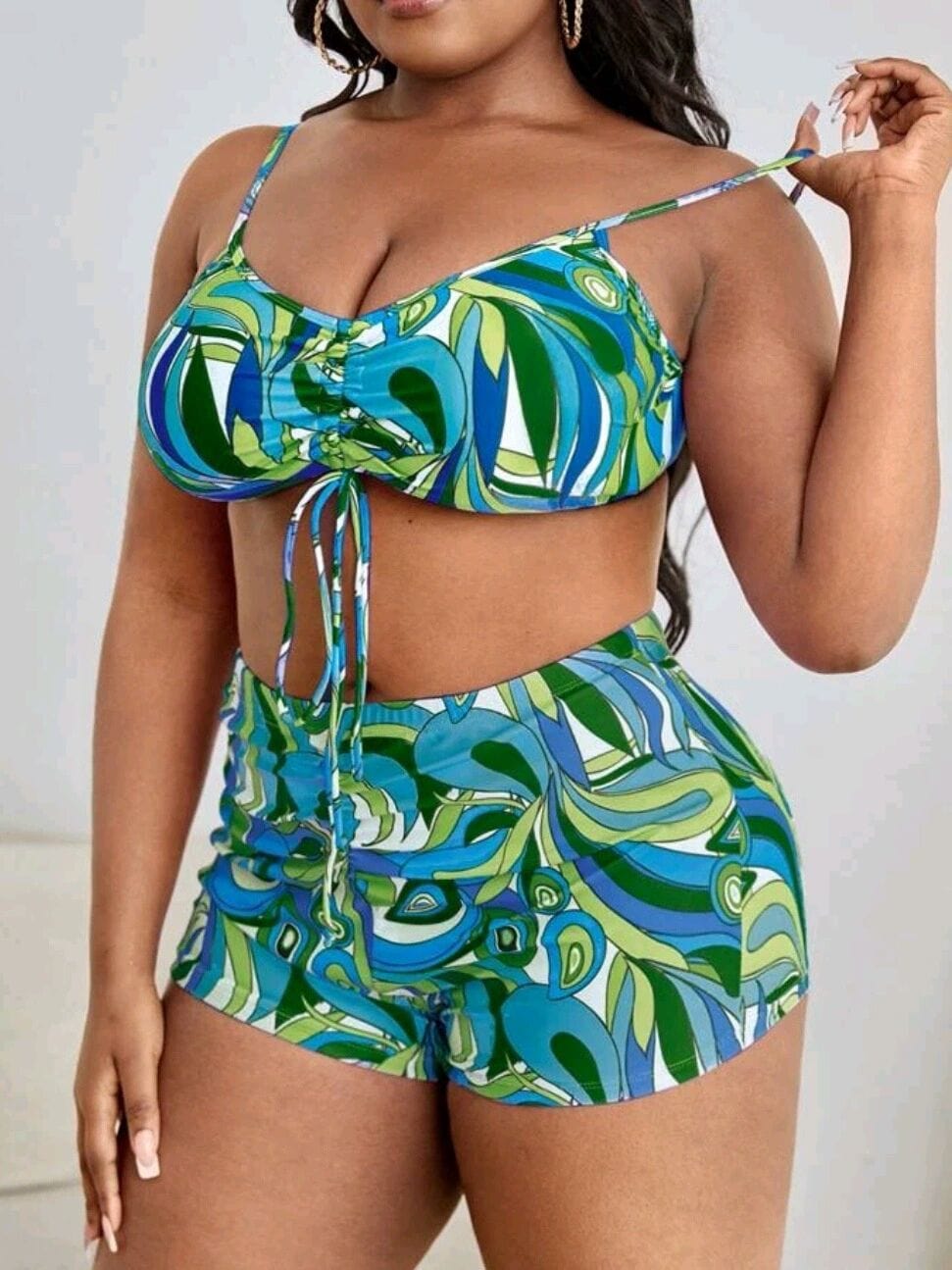 Plus size two-piece swimsuit with decorative tying.