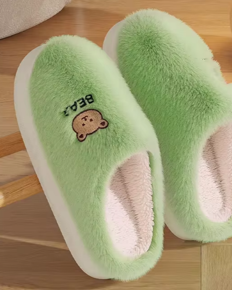 Warm fluffy slippers with a bear